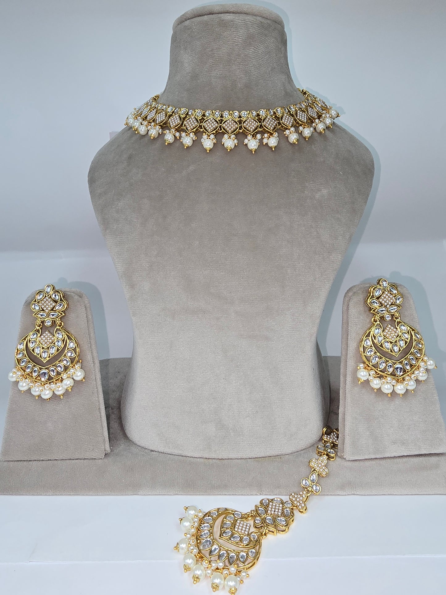 Cream and multi coloured Asian designer sets with earrings n tikka