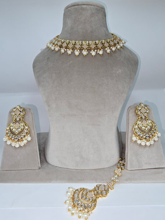Cream and multi coloured Asian designer sets with earrings n tikka