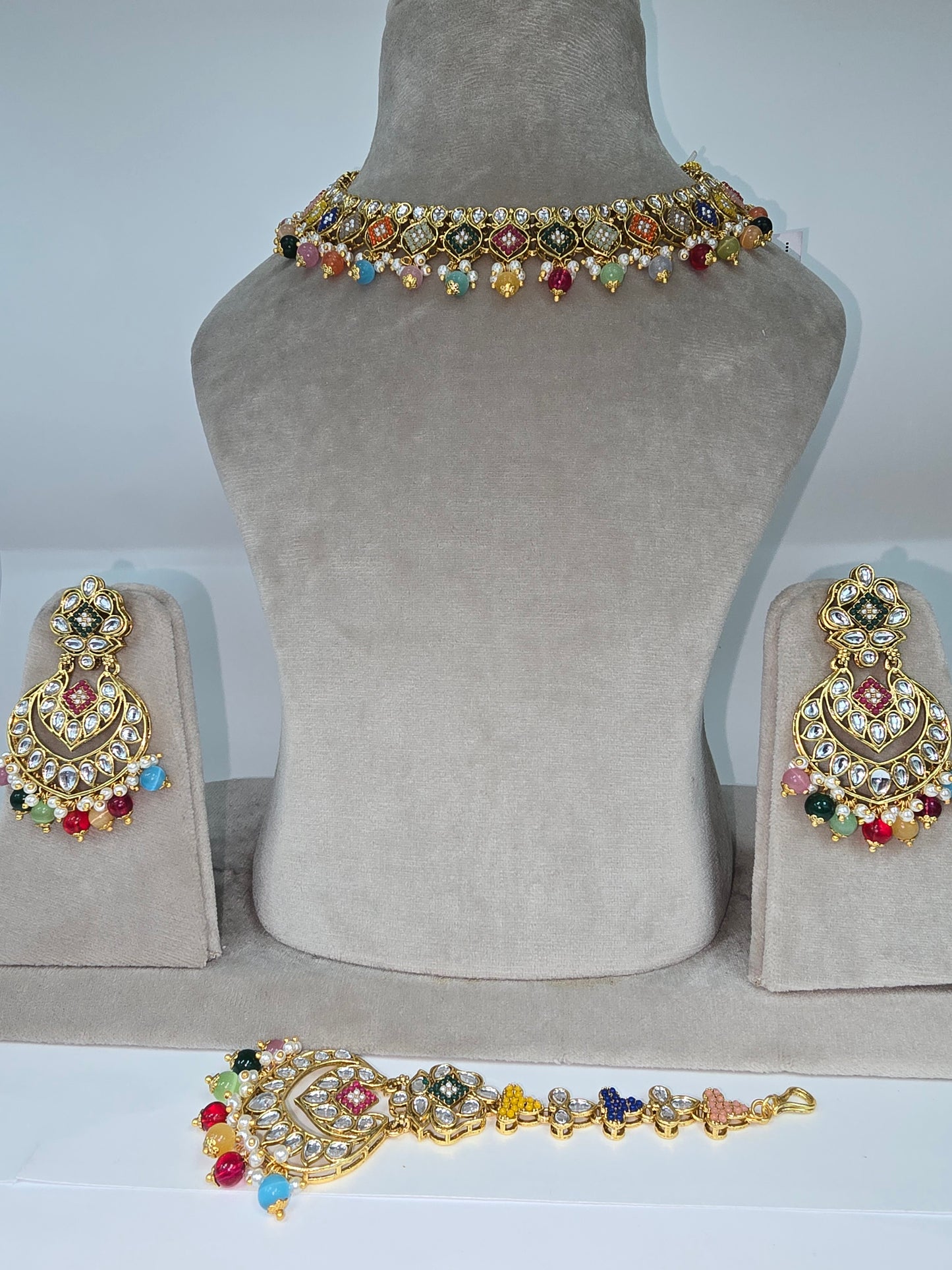 Cream and multi coloured Asian designer sets with earrings n tikka
