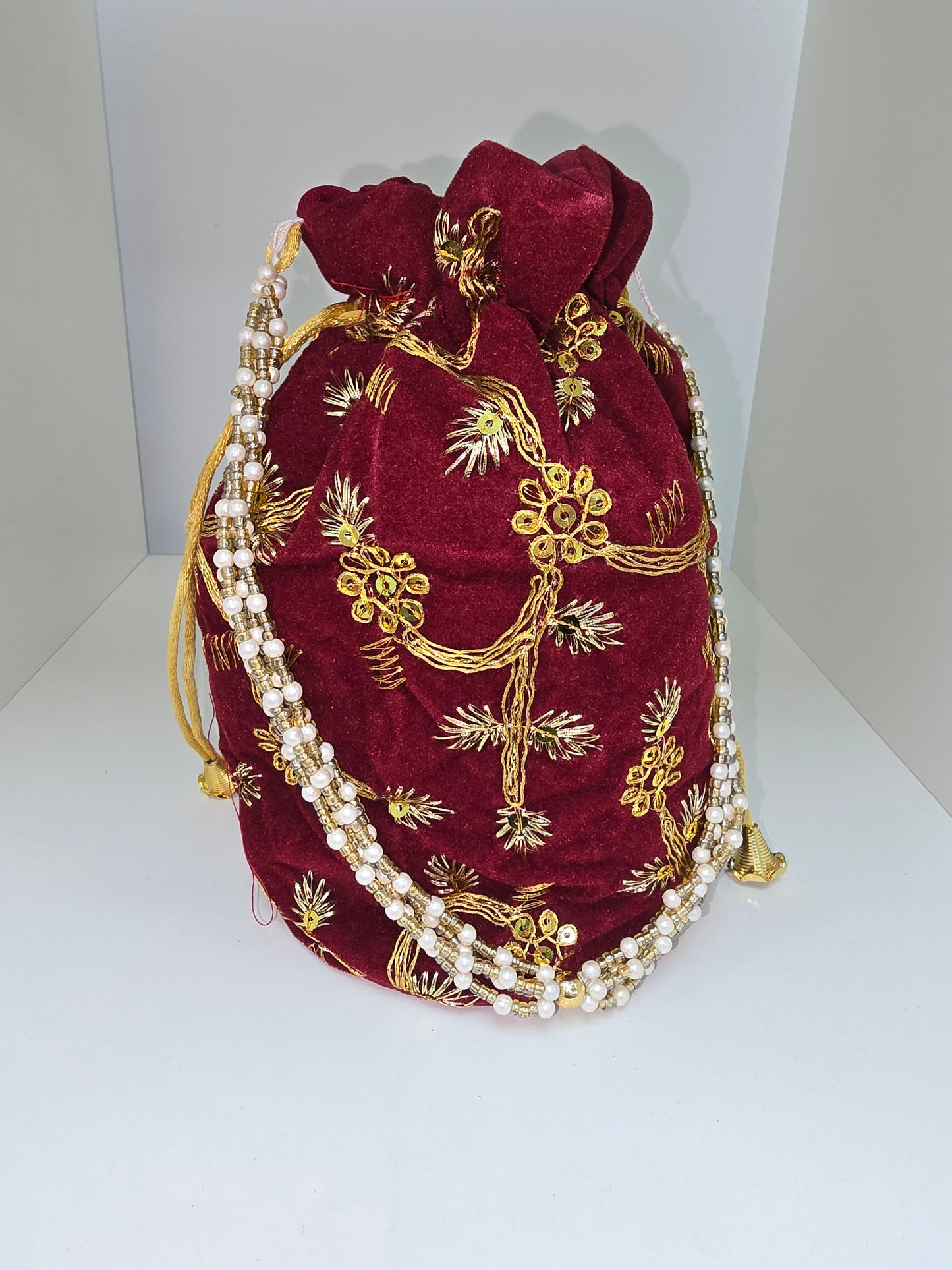 Dark red velvet potli