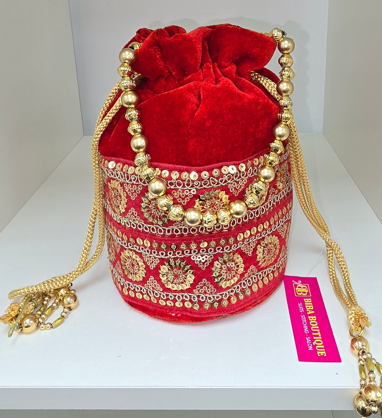 Dark red velvet potli