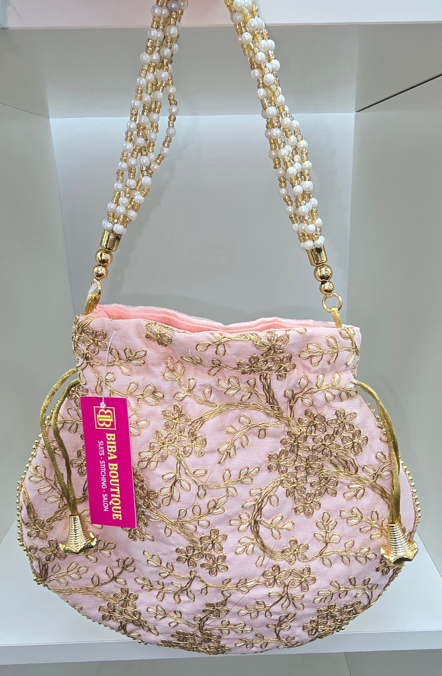 Fancy light pink colour potli
