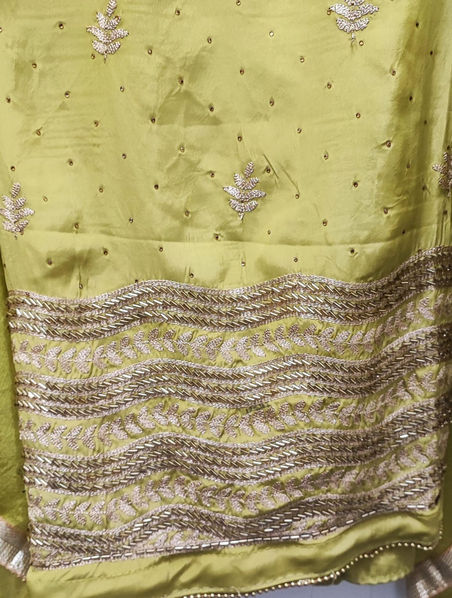 Unstitched dress material in light parrot green colour