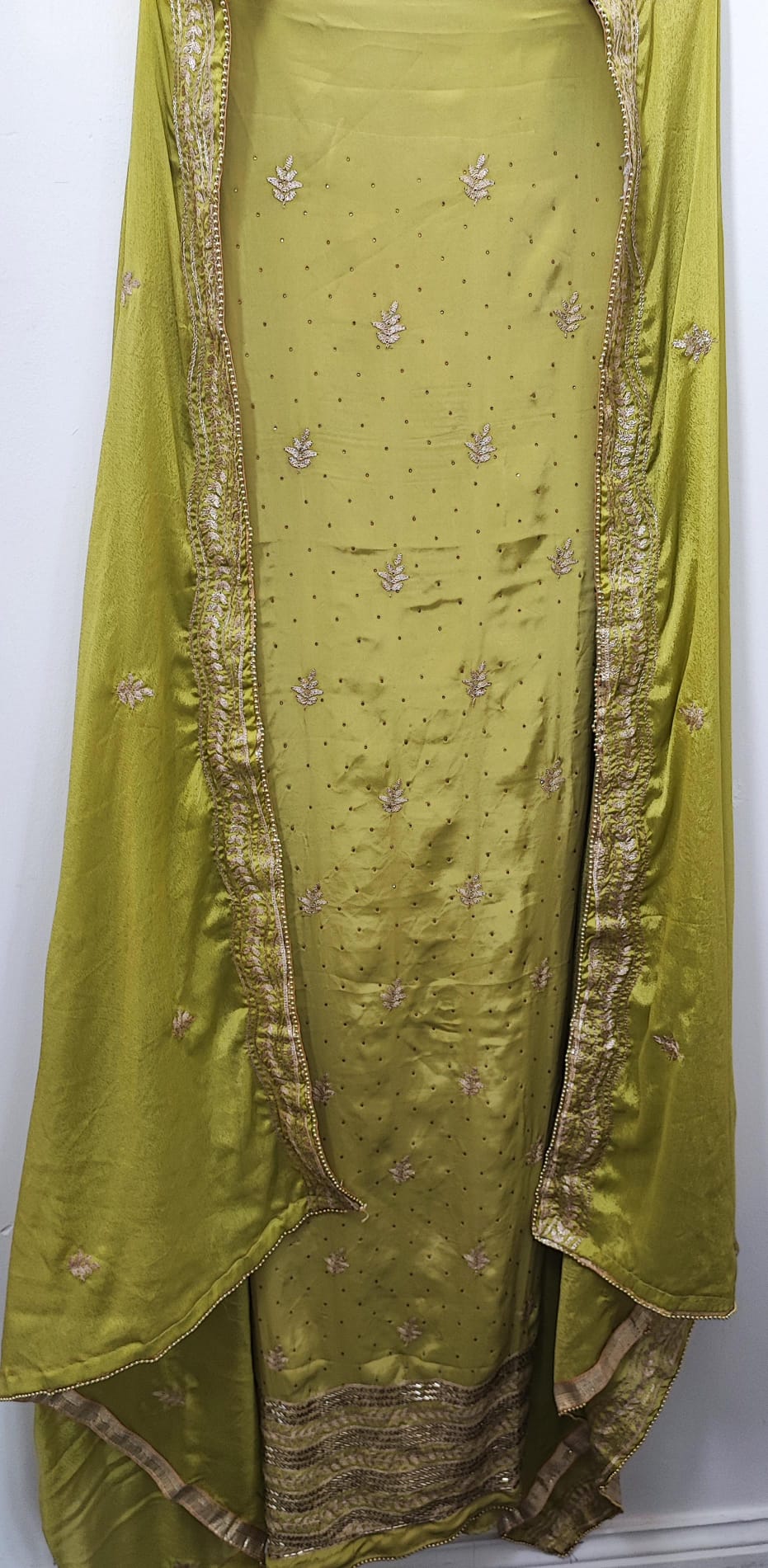 Unstitched dress material in light parrot green colour