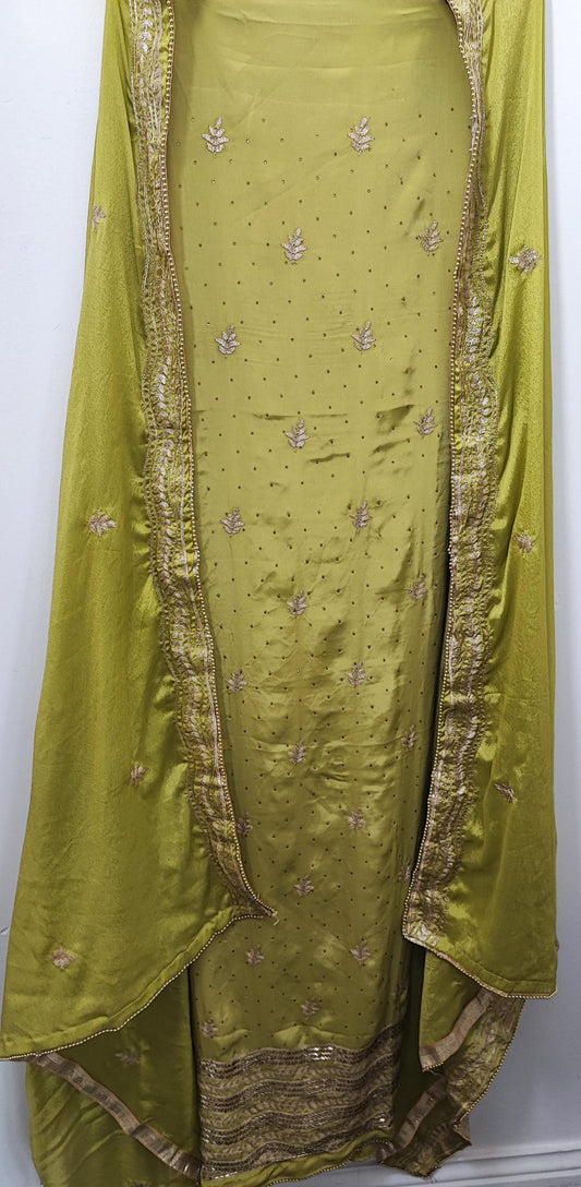 Unstitched dress material in light parrot green colour