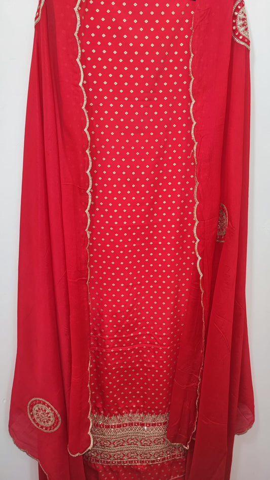 Unstitched dress material in blood red colour