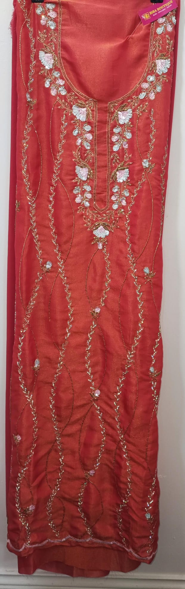 Unstitched dress material in peach colour