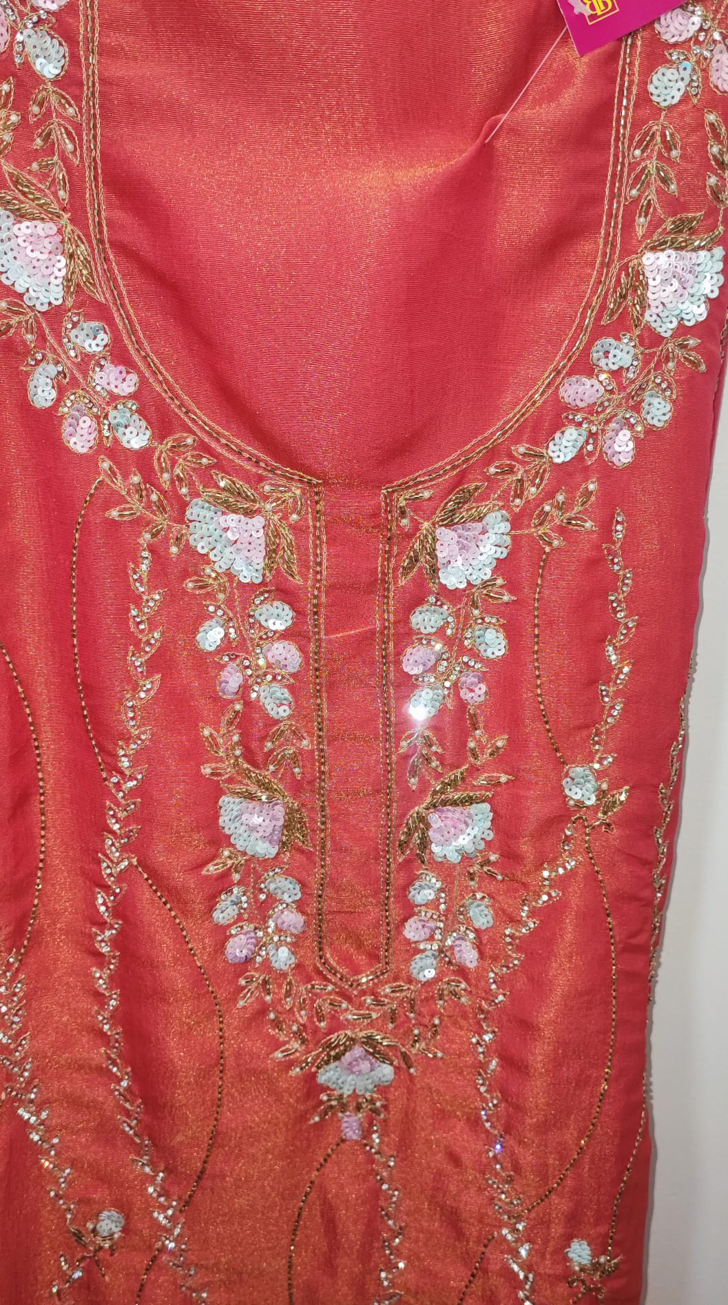Unstitched dress material in peach colour